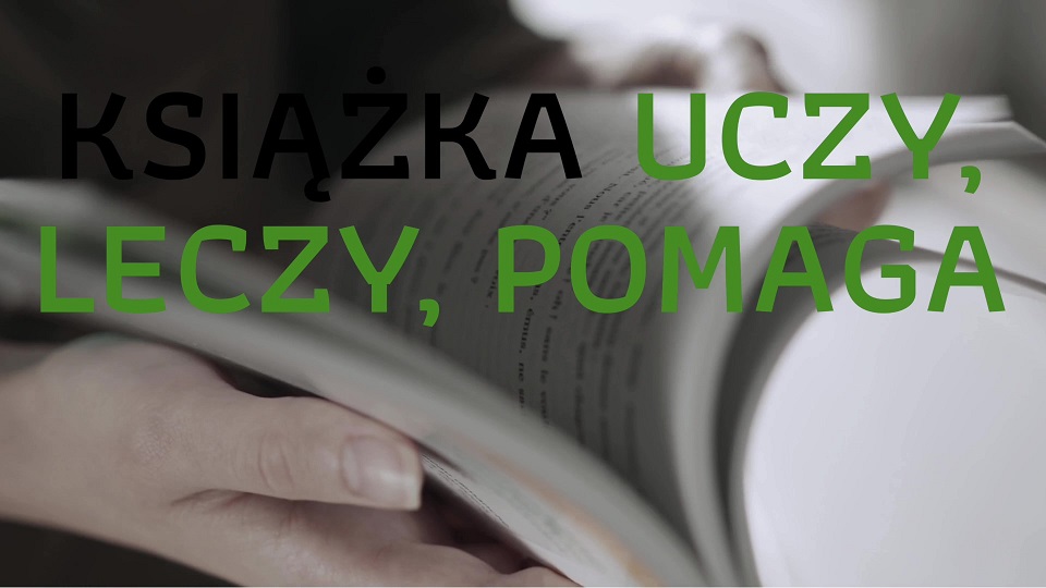 Obraz otwartej książki na tle z napisem "Książka uczy, leczy, pomaga"